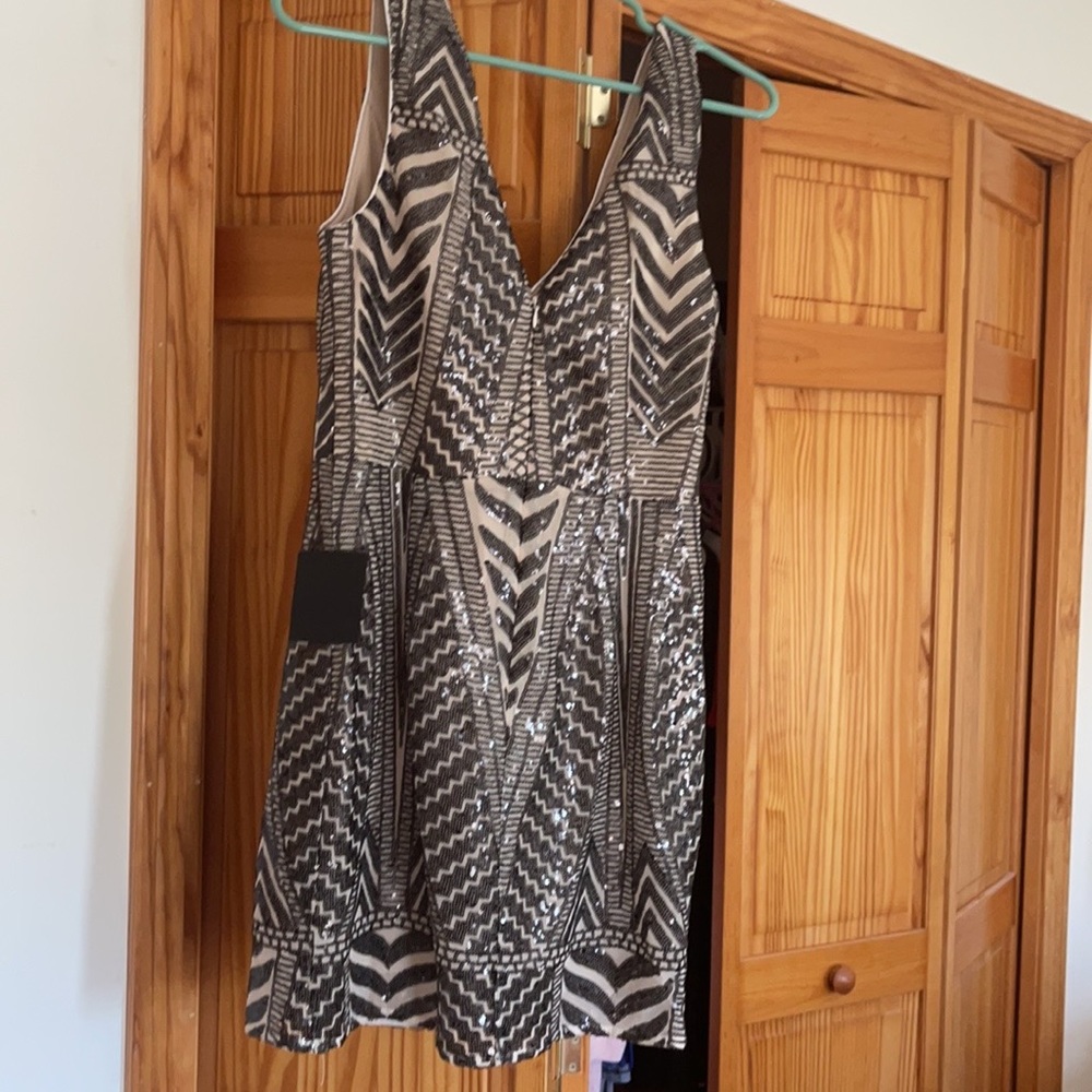 Size medium body con tan w black sequins
